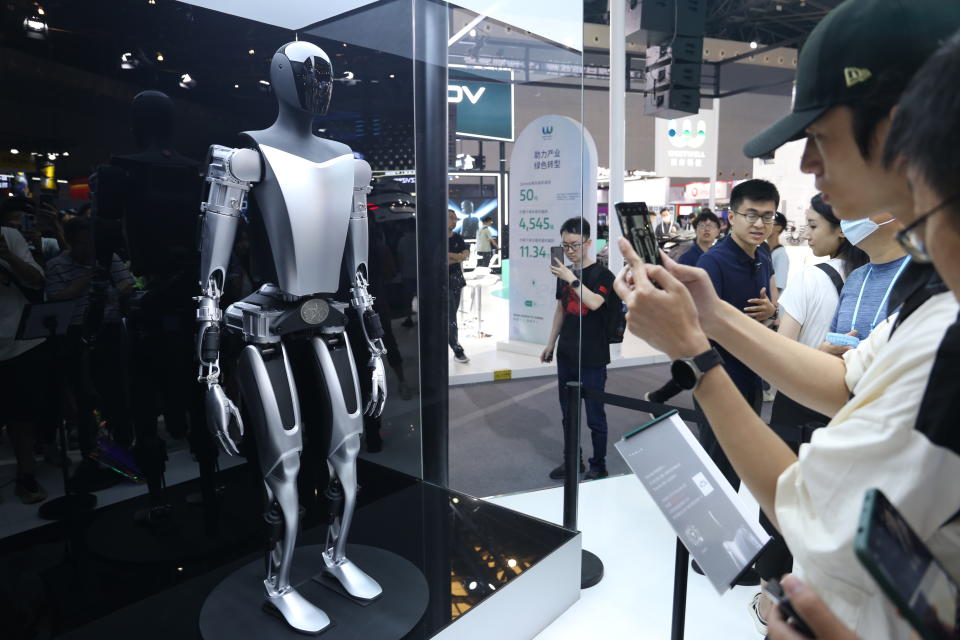 SHANGHAI, CHINA - JULY 6, 2023 - Visitors see Tesla's Tesla Bot humanoid robot 